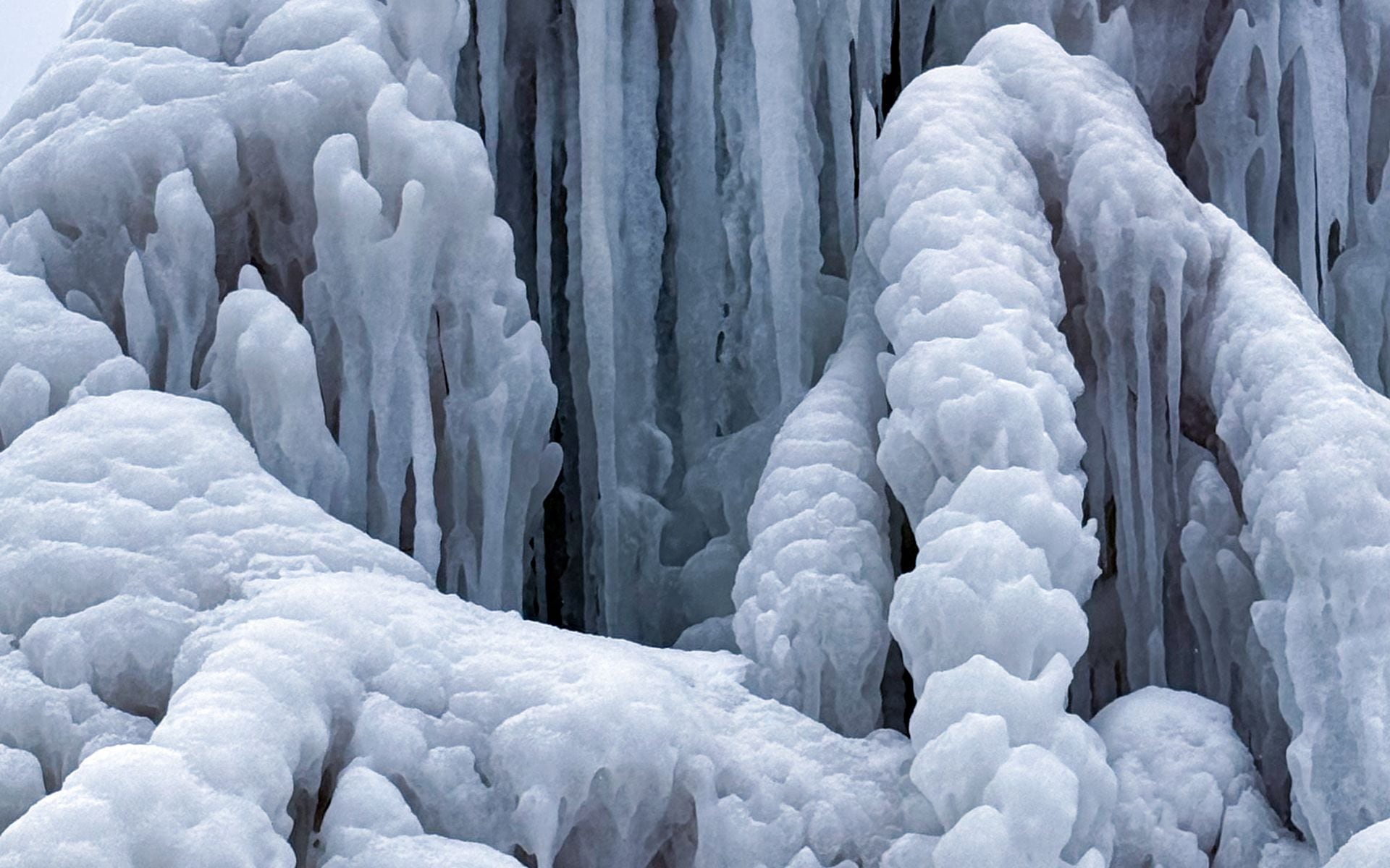 Ice columns and frozen formations lining the sandstone sea cave walls at Meyers Beach on the Apostle Islands National Lakeshore mainland, Wisconsin