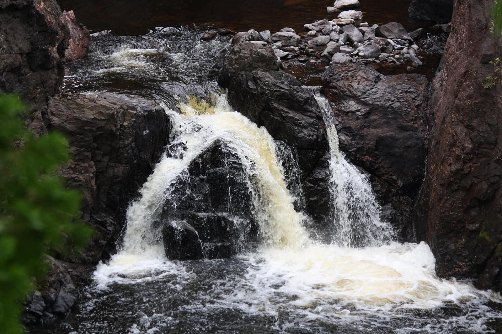 Copper Falls dropping through a dark basalt gorge at Copper Falls State Park near Mellen, Wisconsin