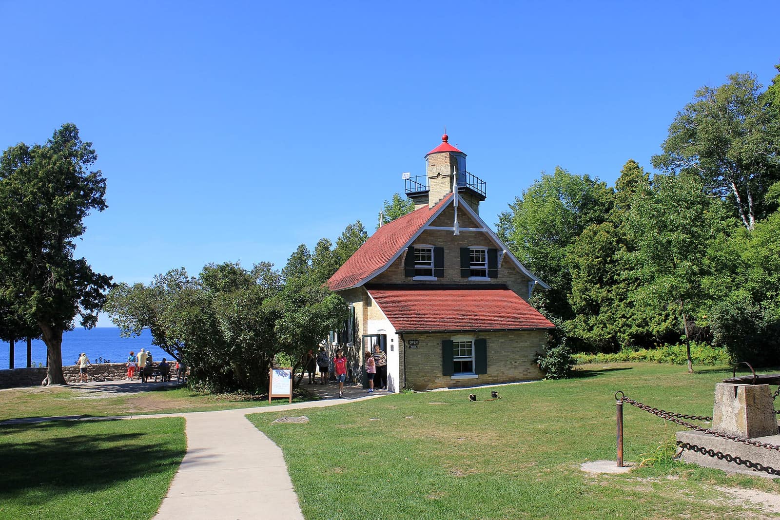 Eagle Bluff Lighthouse at Peninsula State Park in Door County, Wisconsin, with Green Bay visible through the trees behind it